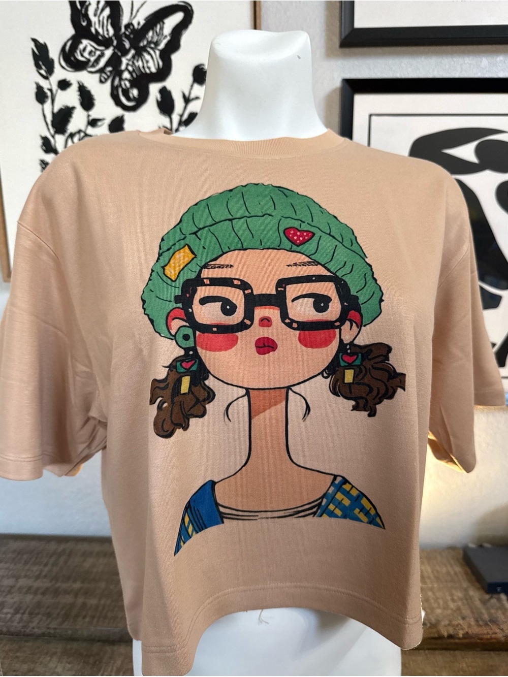 Women's Beige Graphic Tee with Green Beanie Illustration